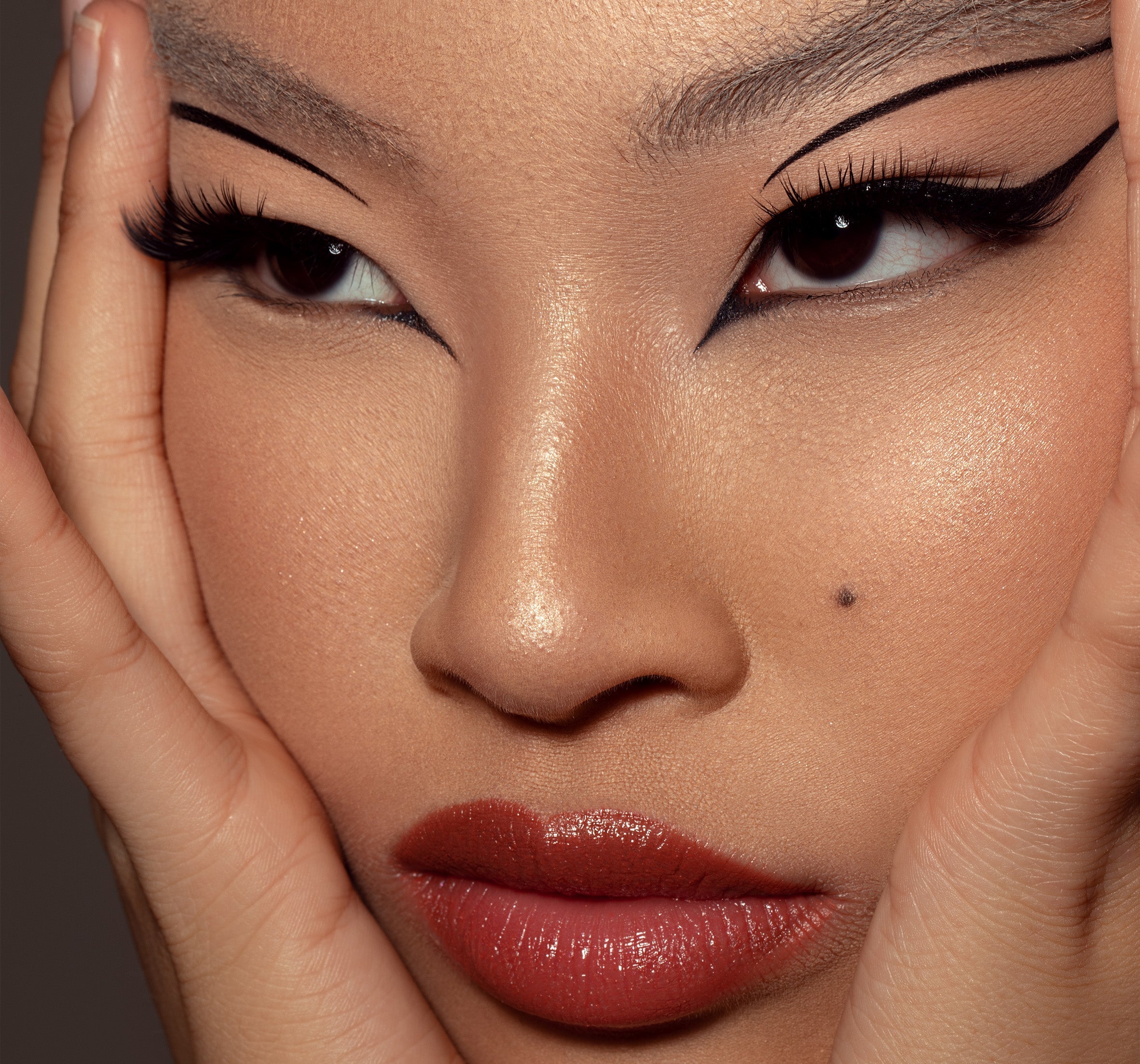 a woman with monolid eyes