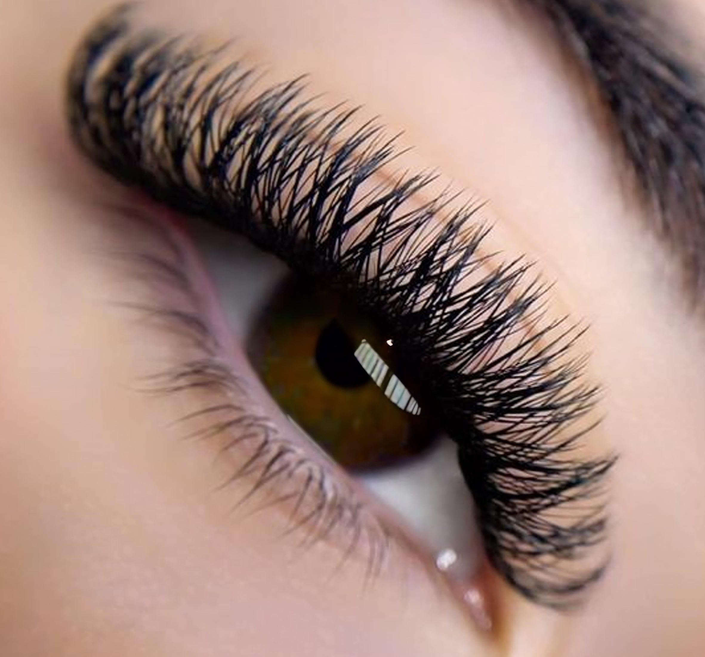 a closeup of an eye with lash extensions