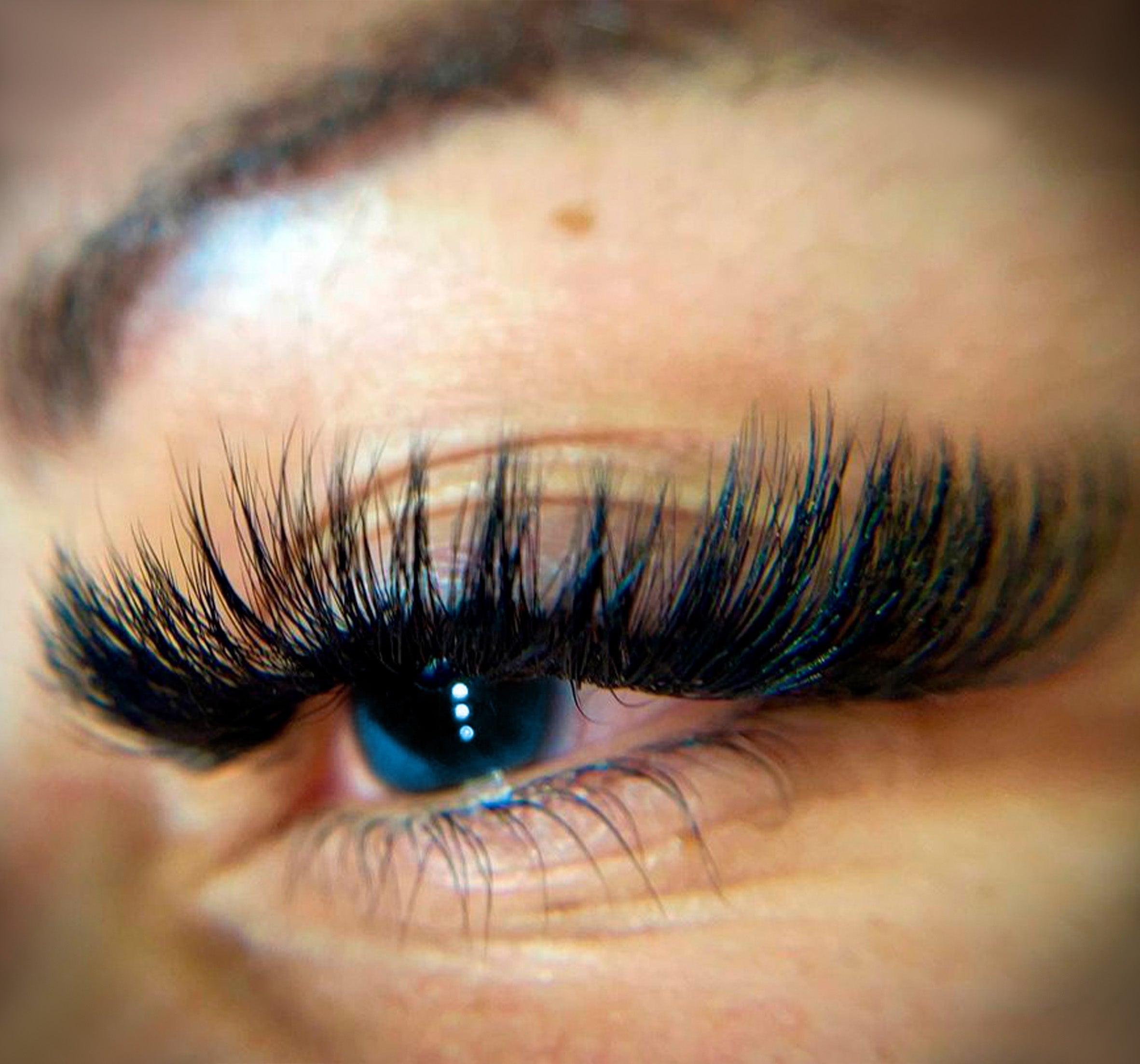 a close up of the eye with eyelash extensions