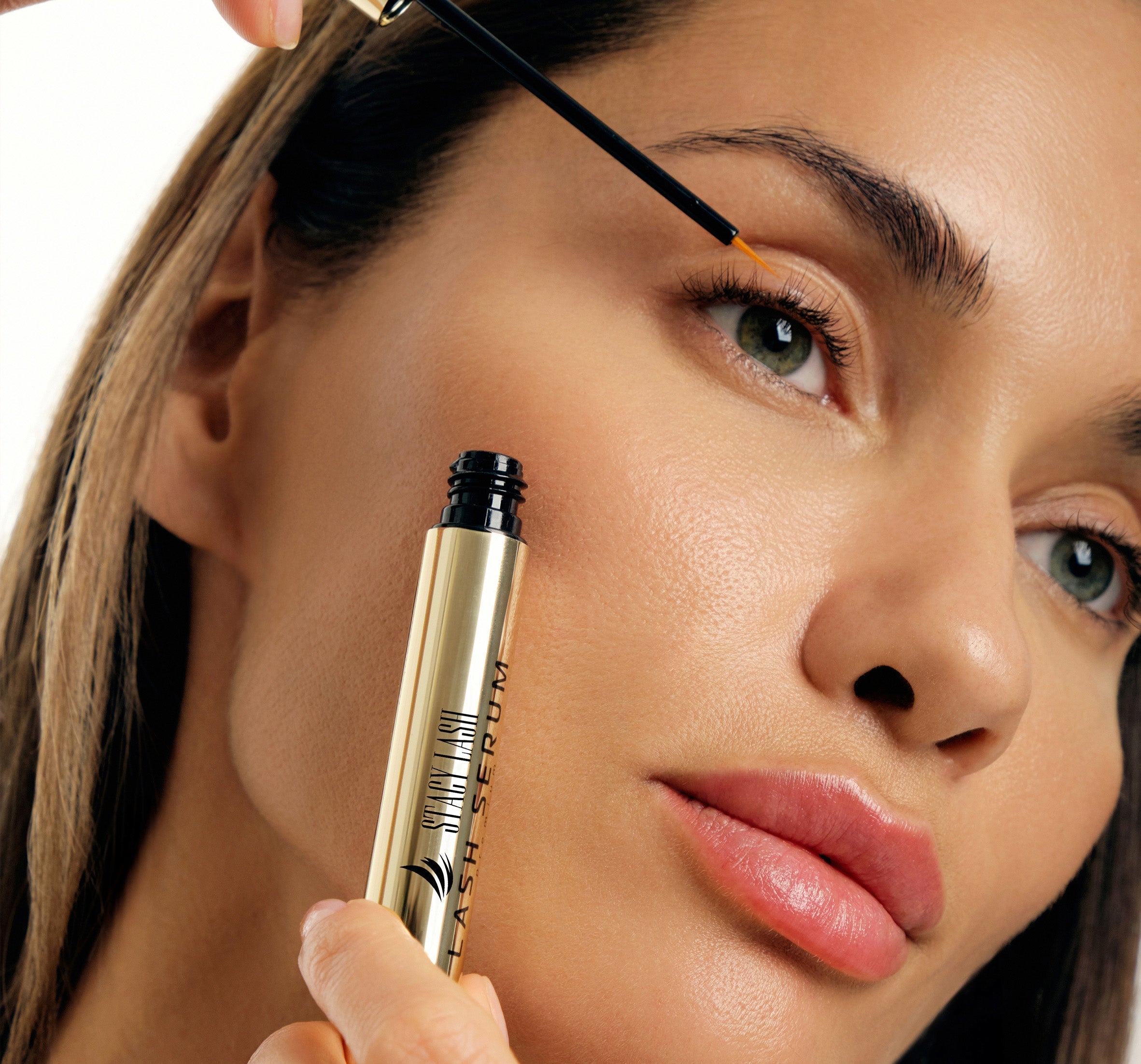 a woman using Stacy Lash serum for eyelash growth