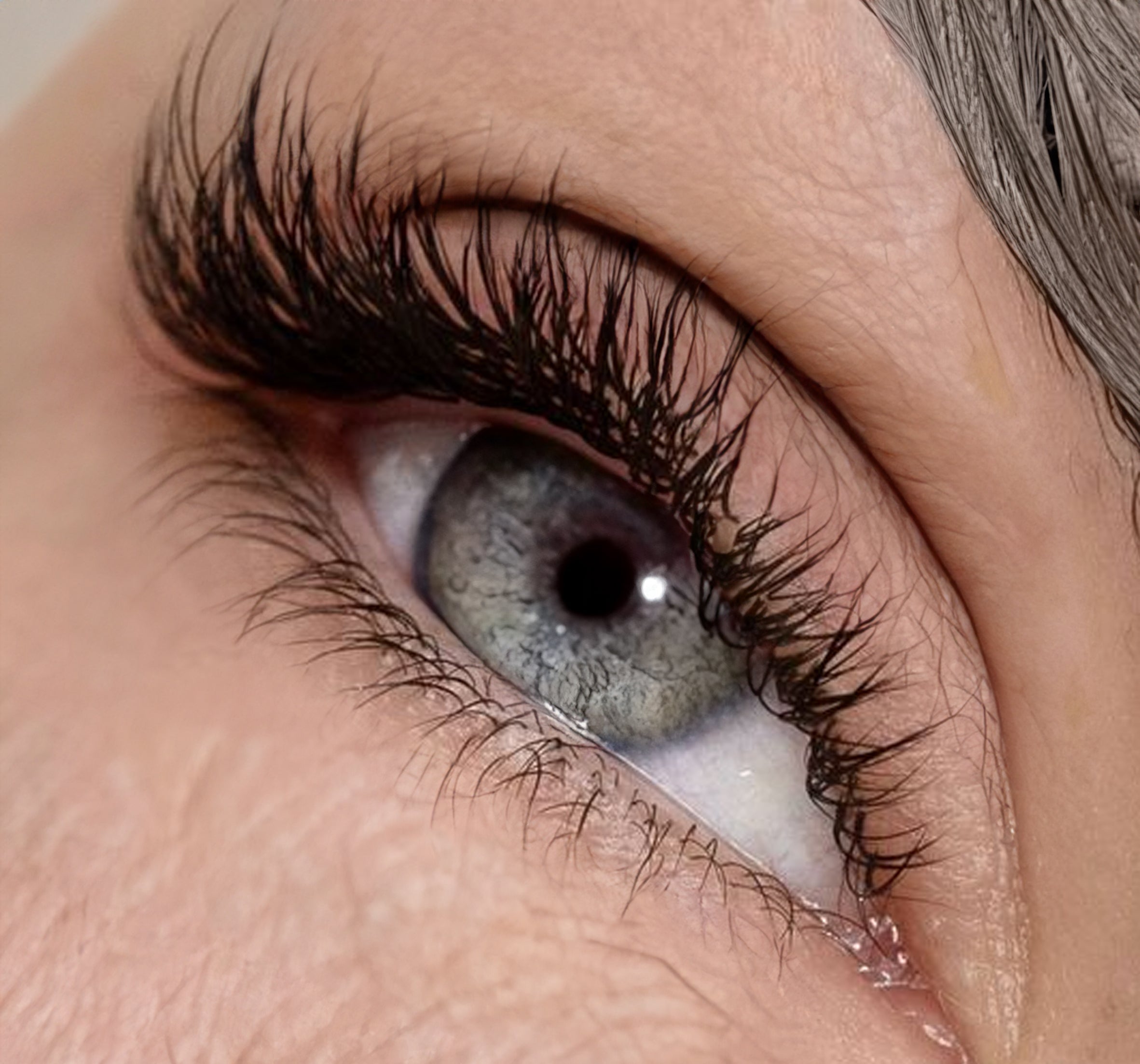 a woman with slight wrinkles and lash extensions on