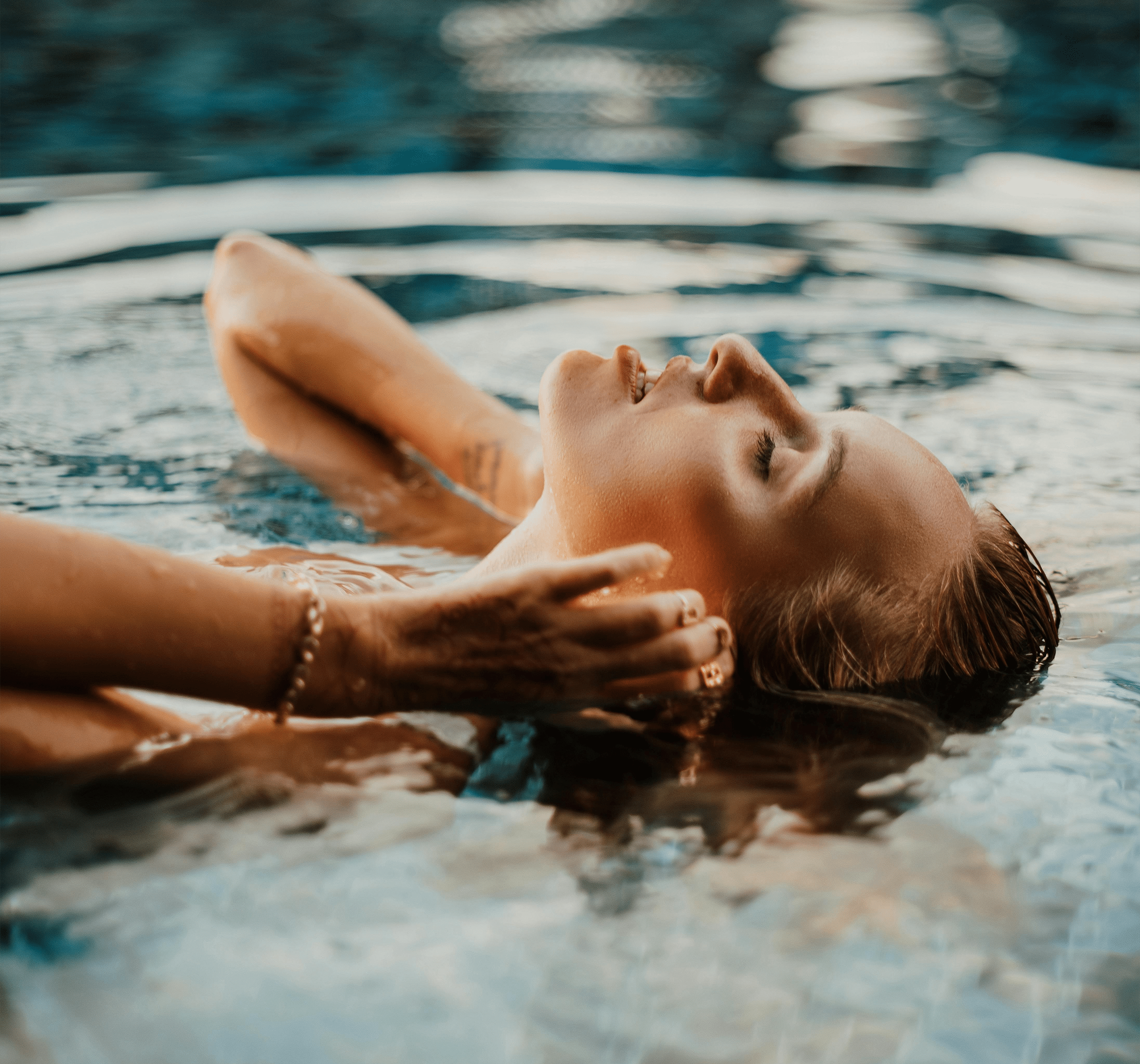 a woman swimming in the pool