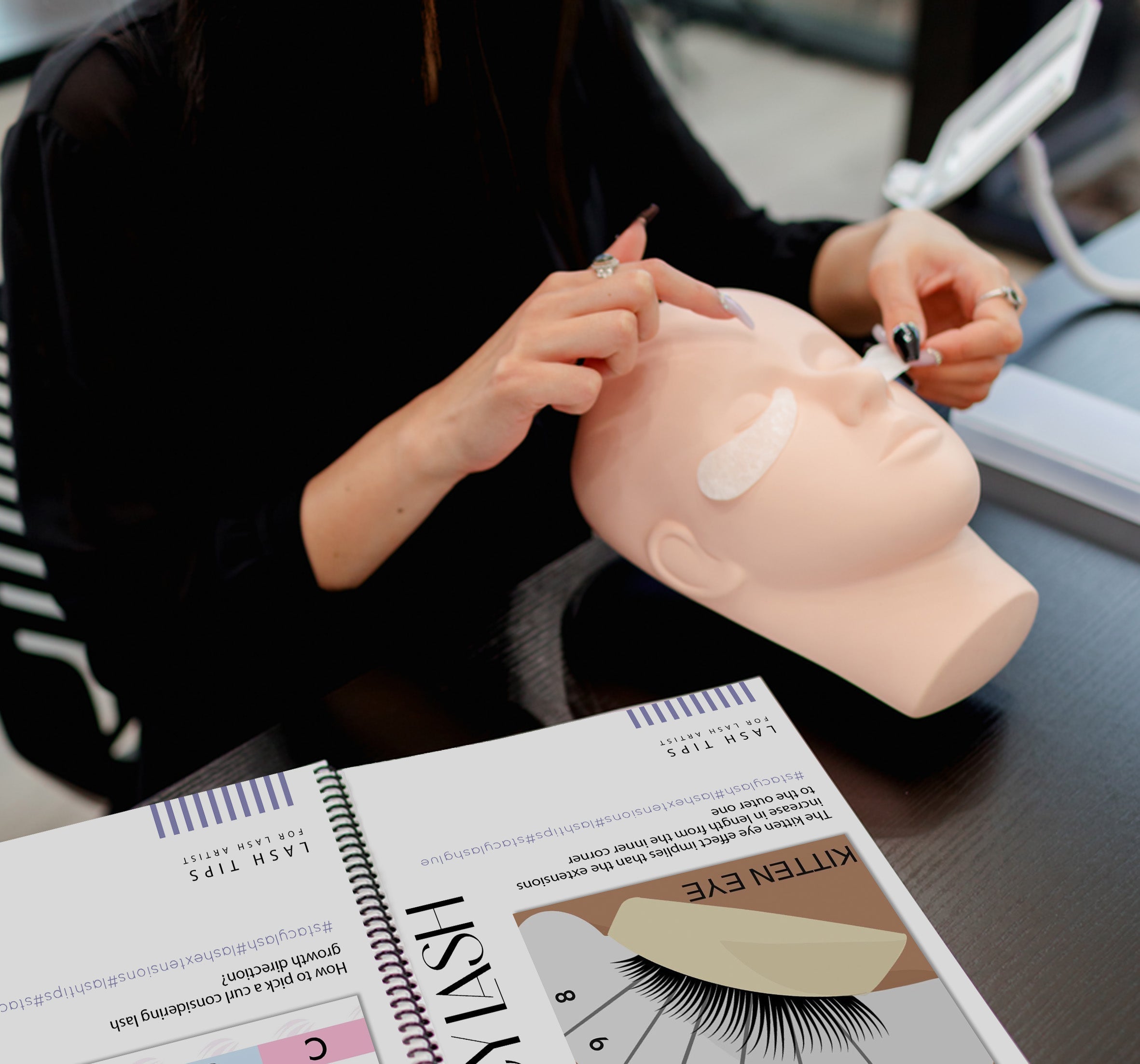 Professional lash artist applying eye patches on a mannequin