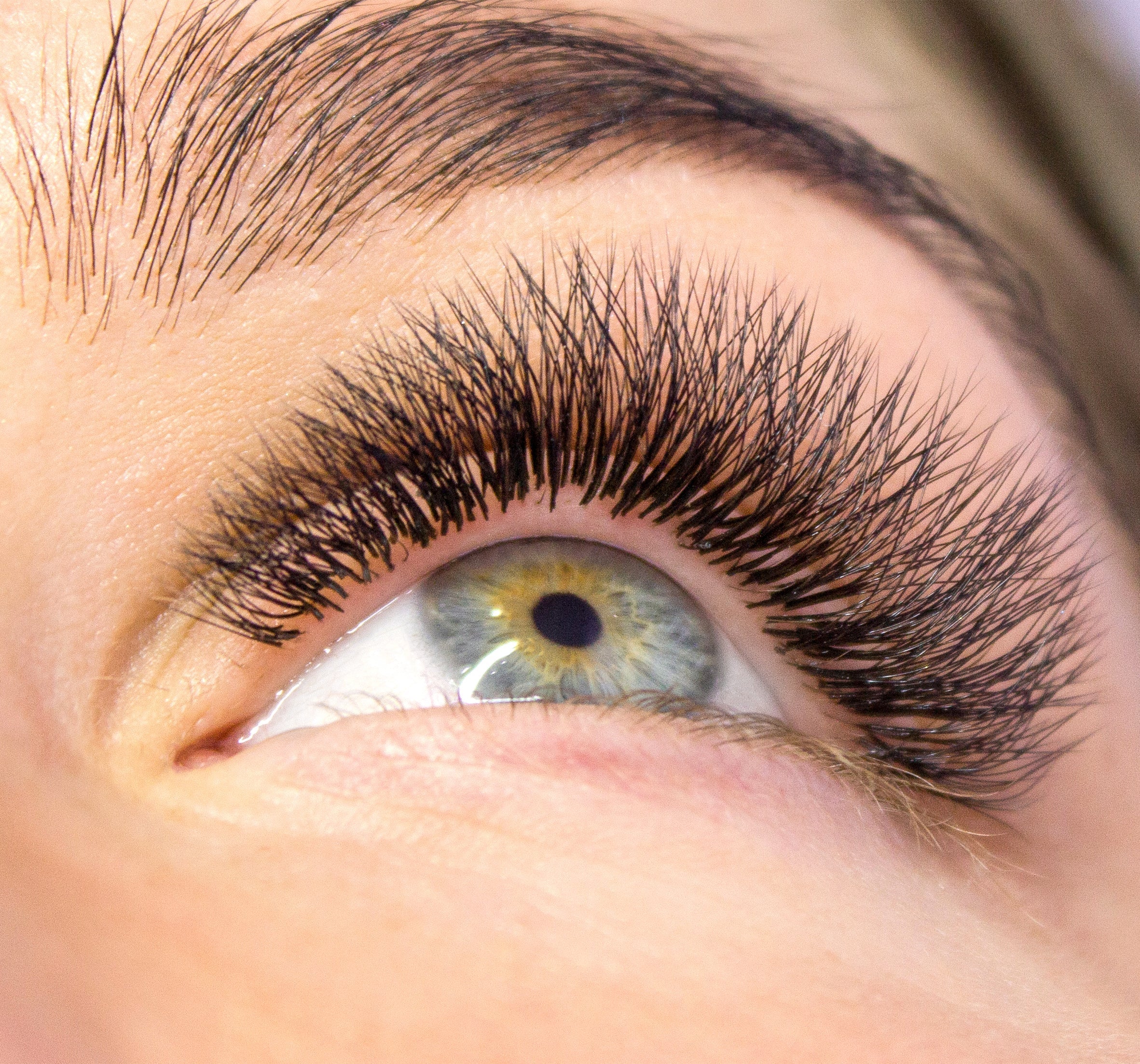 a closeup of an eye with lash extensions on 