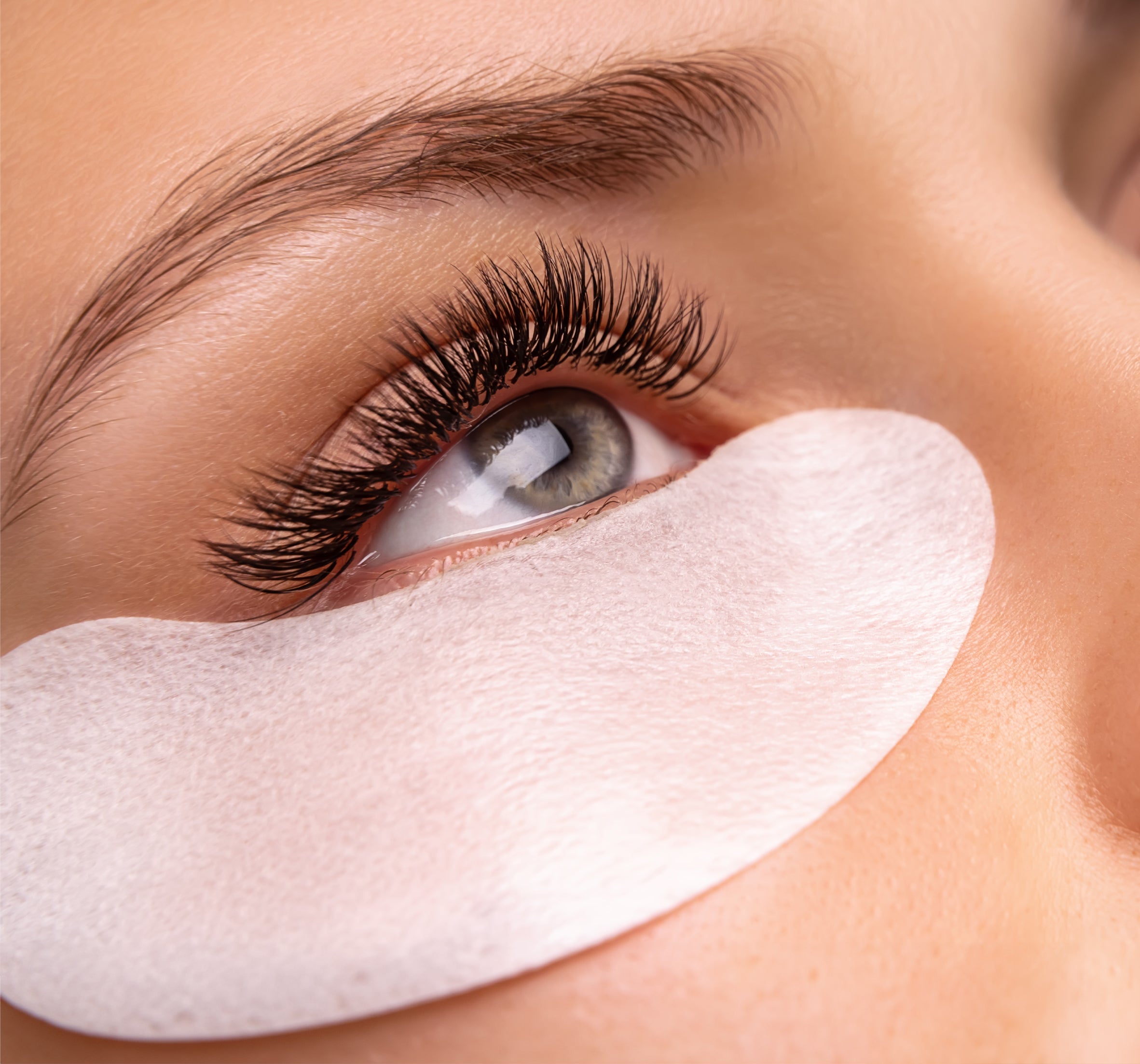 patched down lashes with extensions on